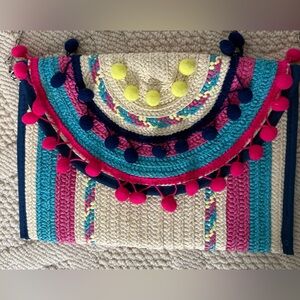 Colorful Woven Tote with Pom Poms and silver chain.